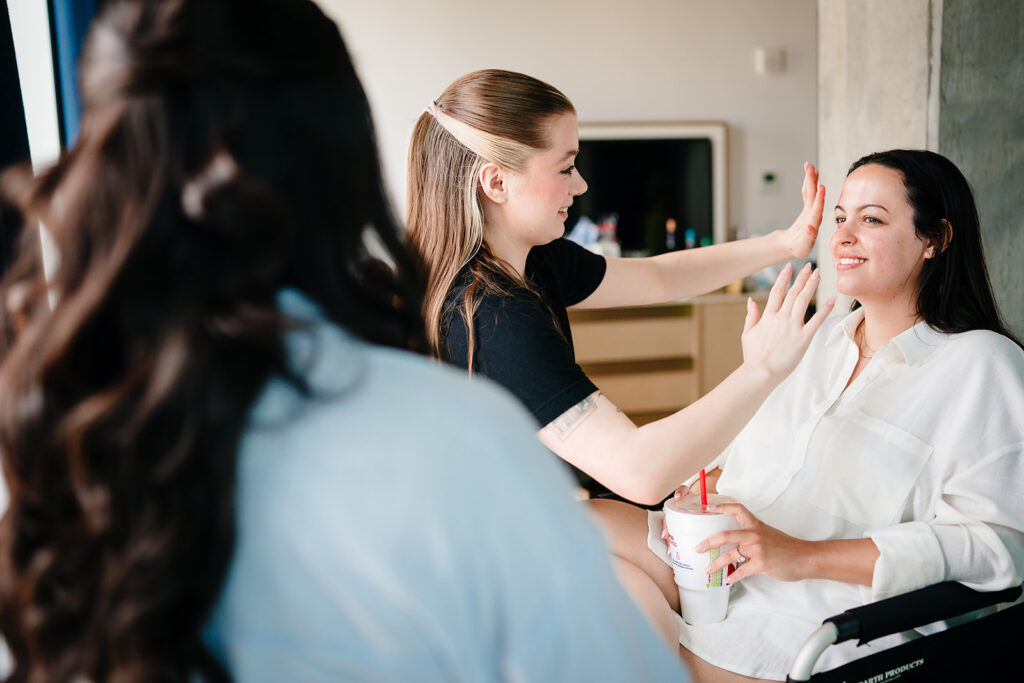 Bride getting ready for North Texas LGBTQ Wedding at The Filter Building on White Rock Lake by Dallas Inclusive Wedding Photographers