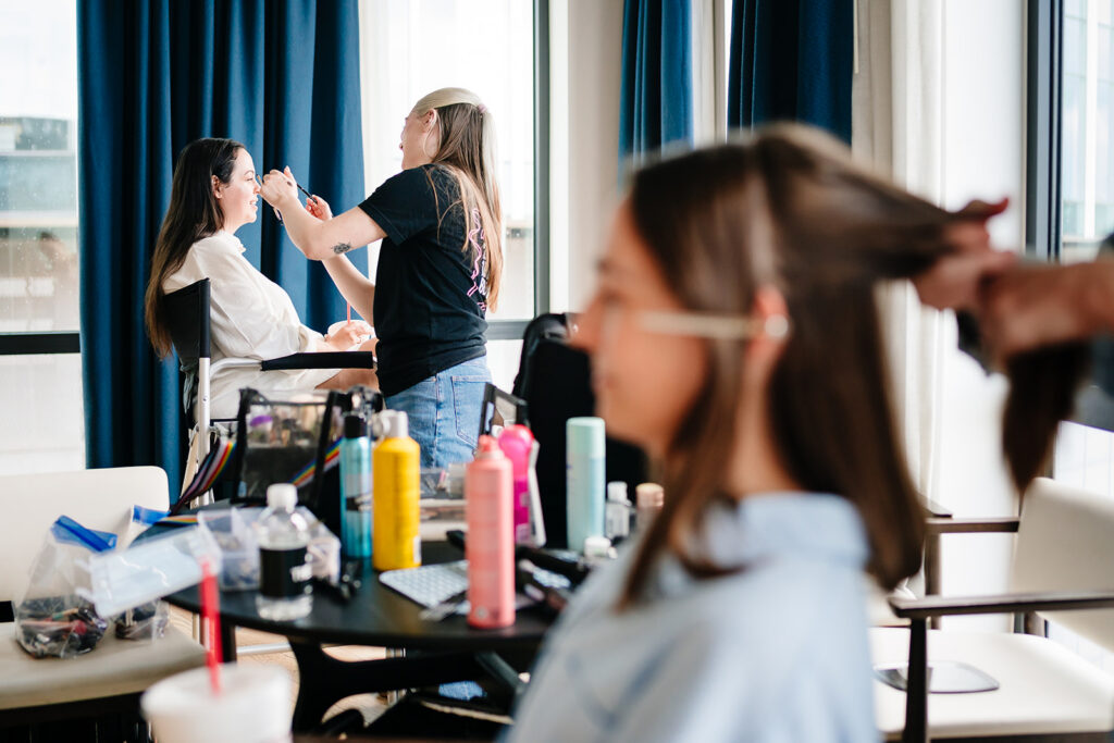 Bride getting ready for North Texas LGBTQ Wedding at The Filter Building on White Rock Lake by Dallas Inclusive Wedding Photographers