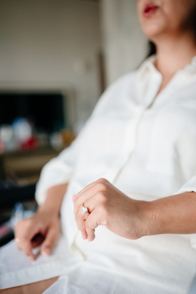 Bride getting ready for North Texas LGBTQ Wedding at The Filter Building on White Rock Lake by Dallas Inclusive Wedding Photographers