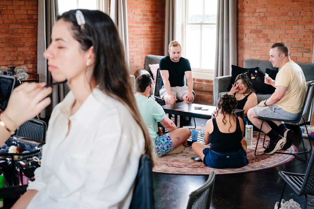Bride getting ready for North Texas LGBTQ Wedding at The Filter Building on White Rock Lake by Dallas Inclusive Wedding Photographers