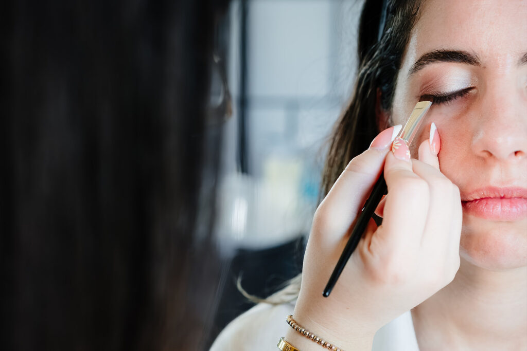 Bride getting ready for North Texas LGBTQ Wedding at The Filter Building on White Rock Lake by Dallas Inclusive Wedding Photographers