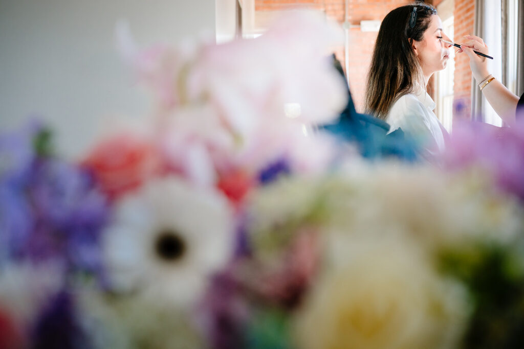 Bride getting ready for North Texas LGBTQ Wedding at The Filter Building on White Rock Lake by Dallas Inclusive Wedding Photographers