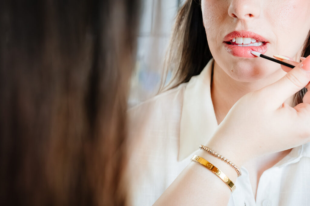 Bride getting ready for North Texas LGBTQ Wedding at The Filter Building on White Rock Lake by Dallas Inclusive Wedding Photographers