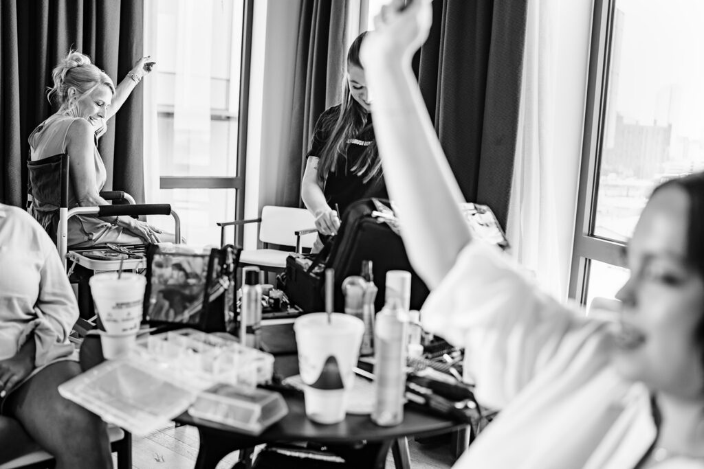 Bride getting ready for North Texas LGBTQ Wedding at The Filter Building on White Rock Lake by Dallas Inclusive Wedding Photographers