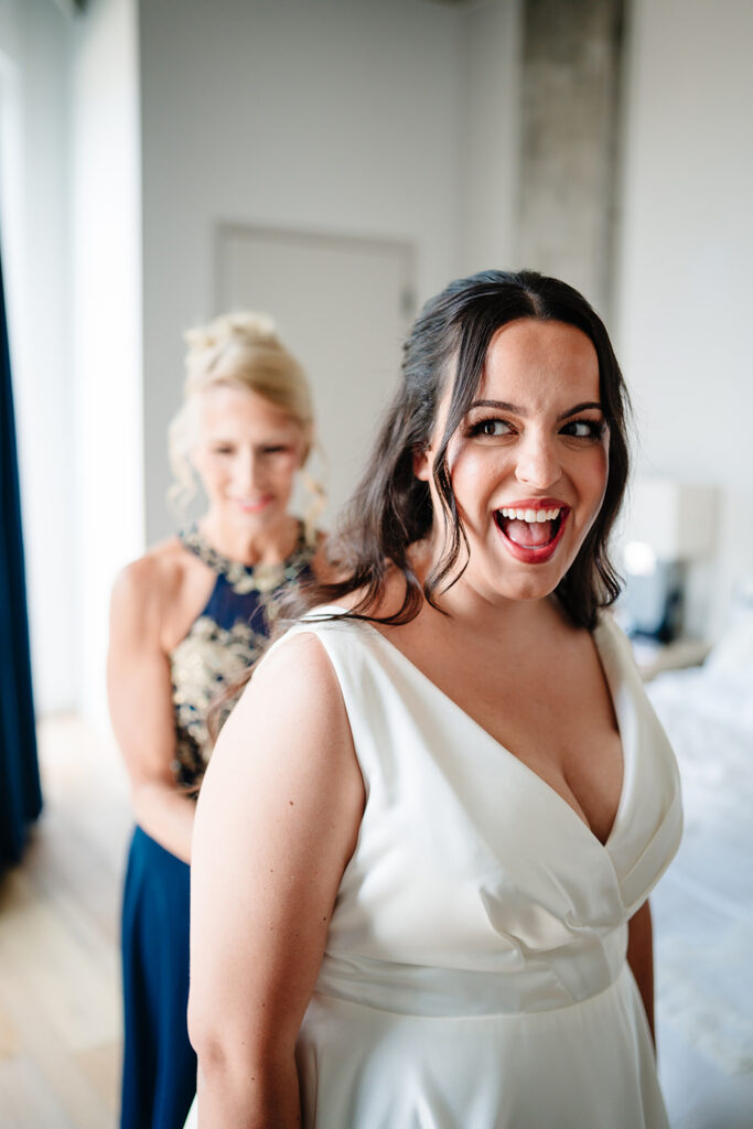 Bride getting ready for North Texas LGBTQ Wedding at The Filter Building on White Rock Lake by Dallas Inclusive Wedding Photographers