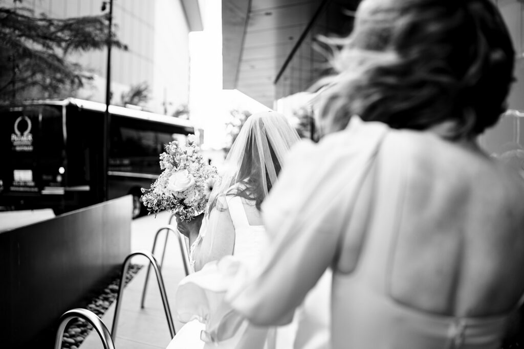 Bride getting ready for North Texas LGBTQ Wedding at The Filter Building on White Rock Lake by Dallas Inclusive Wedding Photographers