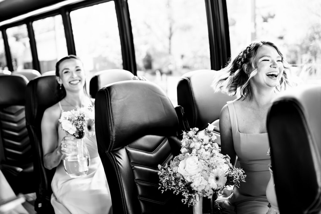Bride singing with friends in party bus on the way to her North Texas LGBTQ Wedding at The Filter Building on White Rock Lake by Dallas Inclusive Wedding Photographers