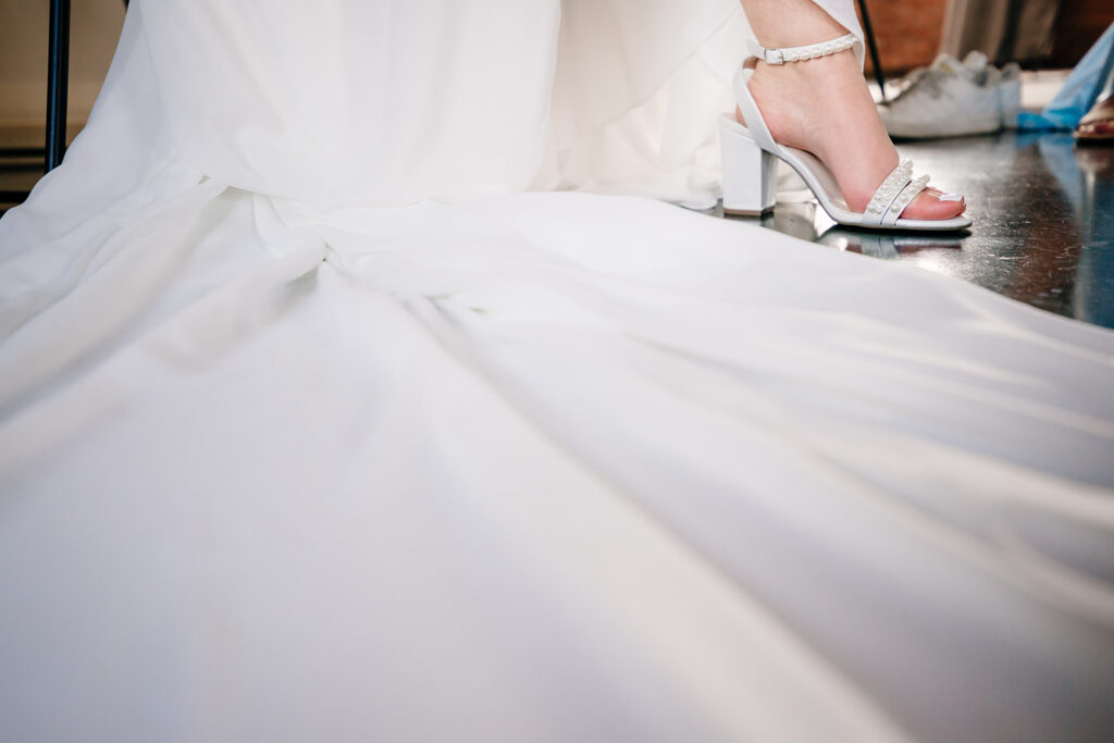 Bride getting ready for North Texas LGBTQ Wedding at The Filter Building on White Rock Lake by Dallas Inclusive Wedding Photographers