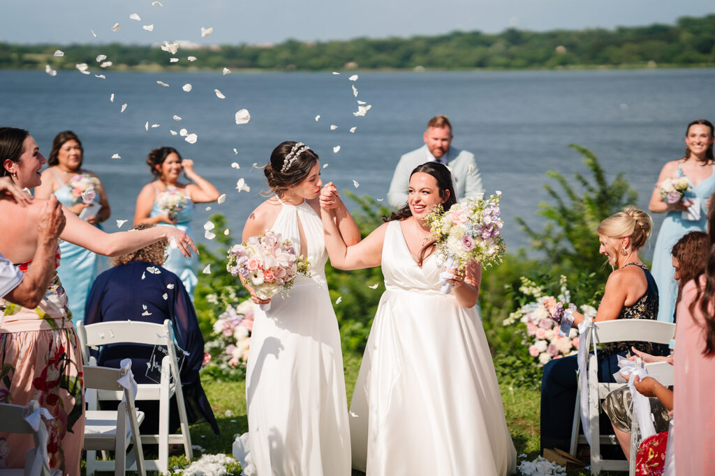 Grand Exit from North Texas LGBTQ Wedding Ceremony at The Filter Building on White Rock Lake by Dallas Inclusive Wedding Photographers