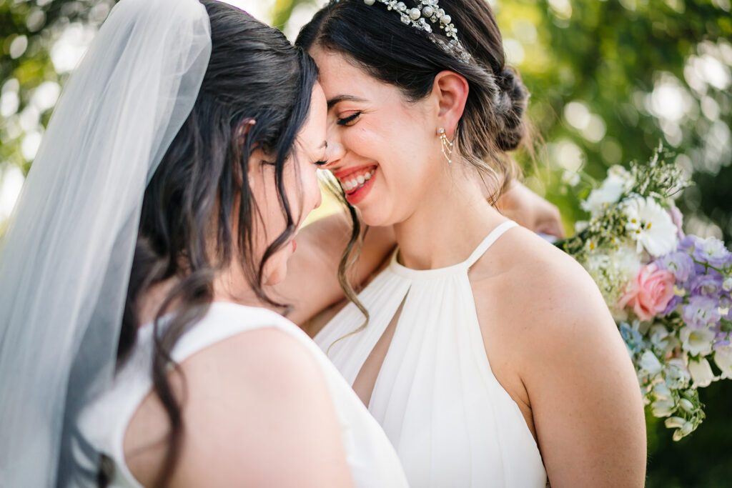 Couples Portraits of Lesbian Brides During North Texas LGBTQ Wedding at The Filter Building on White Rock Lake by Dallas Inclusive Wedding Photographers
