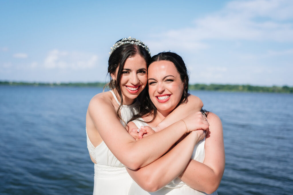 Couples Portraits of Lesbian Brides During North Texas LGBTQ Wedding at The Filter Building on White Rock Lake by Dallas Inclusive Wedding Photographers