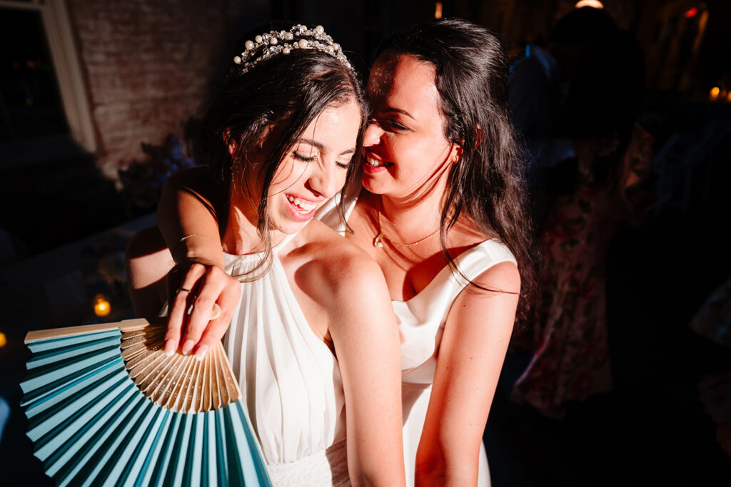 Lesbian Brides Dancing During their North Texas LGBTQ Wedding Reception at The Filter Building on White Rock Lake by Dallas Inclusive Wedding Photographers