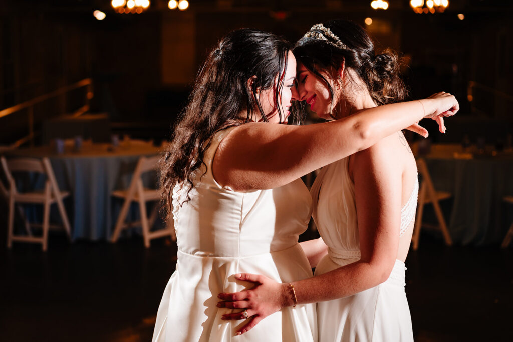 Lesbian Brides at their LGBTQ Wedding at The Filter Building on White Rock Lake by Dallas Inclusive Wedding Photographers