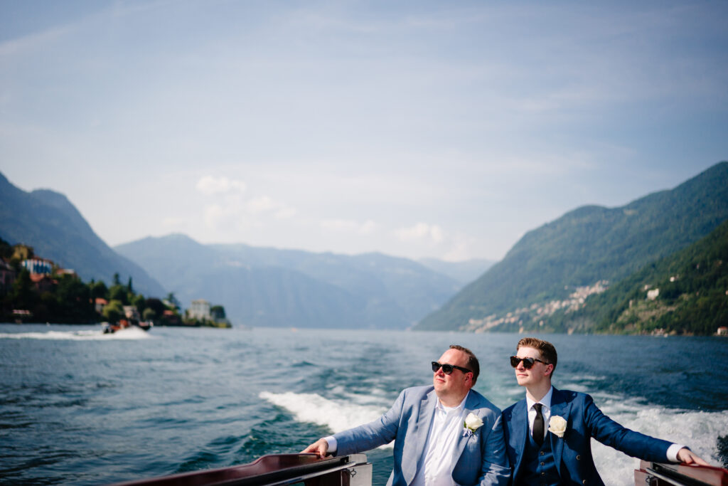 Gay Grooms Couples Boat Portraits on Lake Como in Laglio, Italy at Villa Regina Teodolinda by Destination Wedding Photographers The MacMeekens